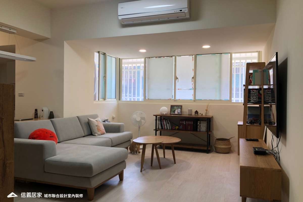 白色客廳室內裝潢設計，包括茶几、矮櫃、L型沙發裝潢圖片