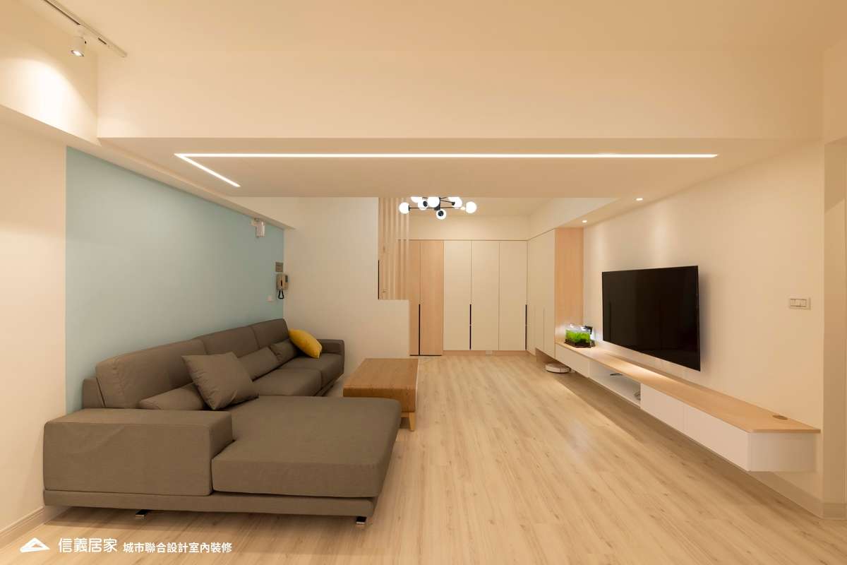 米色客廳室內裝潢設計，包括茶几、收納櫃、吊燈、L型沙發裝潢圖片